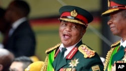 Army General Constantino Chiwenga smiles during the presidential inauguration ceremony in Harare, Zimbabwe, Nov. 24, 2017.