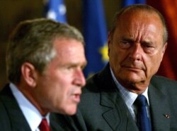 In this file photo taken on May 26, 2002 US President George W. Bush (L) and French President Jacques Chirac hold a press conference in the gardens of the Elysee Palace in Paris.