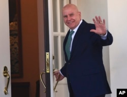 FILE - National security adviser H.R. McMaster waves as he walks into the West Wing of the White House in Washington, March 16, 2018.