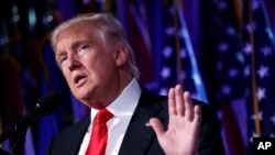 President-elect Donald Trump speaks during a rally in New York on November 9, 2016. Trump elicited wild cheers on the campaign trail by pledging to “drain the swamp” in Washington but the president-elect’s transition team is populated largely with creatur