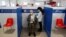 A man receives his third dose of coronavirus disease (COVID-19) vaccine at a Red Cross vaccination centre by Termini, Rome's main train station, as the government discusses more stringent rules for the health pass known as a Green Pass, in Rome, Italy, No