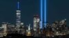 FILE - The Statue of Liberty shines on Sept. 11, 2021 near the Tribute in Light as part of the commemoration for 20th anniversary of the terrorist attack in New York City. 