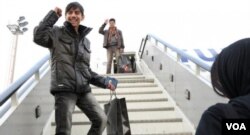 Fawad Mohammadi, star of the short film Buzkashi Boys, boards a plane bound for Los Angeles and the Academy Awards. Co-star Jawanmard Paiz is in the background. (Photo: US Embassy Kabul)