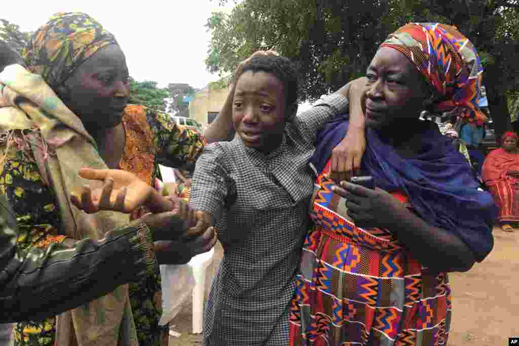 A student who was abducted and then released is reunited with her family at the Bethel Baptist High School in Damishi, Nigeria, July 25, 2021.