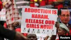 FILE - A protester calls for the release of schoolgirls abducted in April by Boko Haram. 