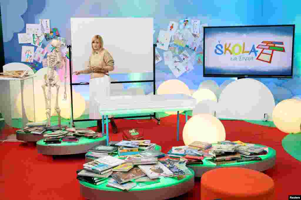 A teacher gives a lecture during the &quot;School on Third&quot; program in Croatian National Televisin (HRT) headquarters in Zagreb. Due to the coronavirus outbreak all schools in Croatia are closed, children can attend school at home on Croatian National Televison and online.