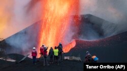 Scientists from CSIC (Spanish National Research Council) take geophysics measurements on the Canary Island of La Palma, Spain, on November13, 2021. (AP Photo/Taner Orribo)