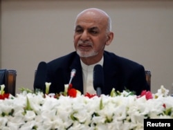 FILE - Afghan President Ashraf Ghani speaks during during a peace and security cooperation conference in Kabul, Afghanistan, Feb. 28, 2018.