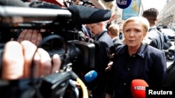 Marine Le Pen, French National Front political party leader and candidate for French 2017 presidential election, arrives at her campaign headquarters in Paris, April 28, 2017.