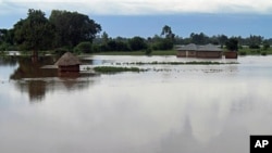 Homes flooded by water after the river Sondu Miriu burst it's banks in southern Nyanza , Kenya, April 29, 2012.