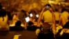 A protester takes pictures of fellow demonstrators as they block the main street to Hong Kong's financial Central district, September 29, 2014.