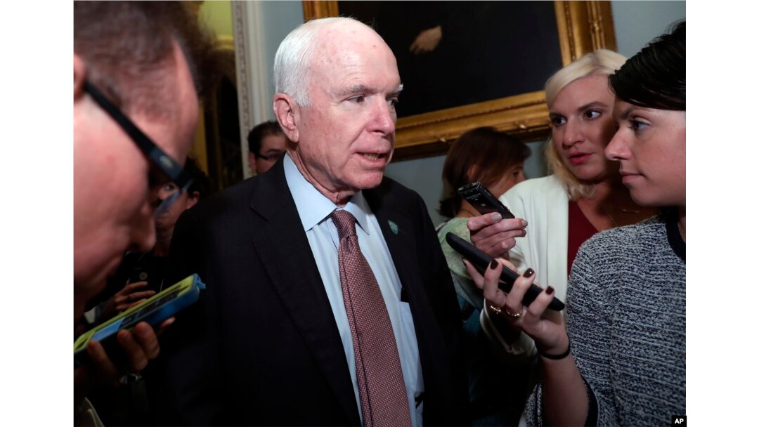 Sen. John McCain, R-Ariz., speaks with reporters before heading into a policy luncheon on Capitol Hill, Sept. 19, 2017, in Washington.