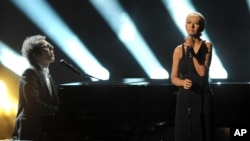 Ian Axel, left, of A Great Big World performs on stage with Christina Aguilera at the American Music Awards at the Nokia Theatre L.A. Live on Nov. 24, 2013, in Los Angeles.