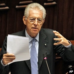Italy's Prime Minister Mario Monti gestures during a vote of confidence at the Lower House of Parliament in Rome, November 18, 2011