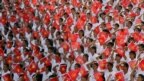 Students wave the Vietnamese national flag