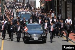 Peru's President Martin Vizcarra leaves the congress building in a motorcade, after being sworn in, Lima, Peru, March 23, 2018.