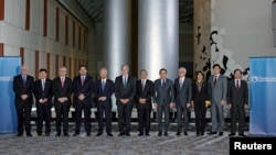 FILE - Trade ministers from a dozen Pacific nations gather for a meeting of Trans-Pacific Partnership ministers in Atlanta, Georgia, Oct. 1, 2015. Representatives from 12 countries that formed the TPP, plus China and South Korea, will meet in Chile in March 2017 in an effort to find an alternative Asia-Pacific trade pact.