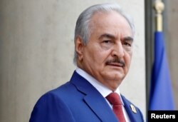 FILE PHOTO: Khalifa Haftar, the military commander who dominates eastern Libya, arrives to attend an international conference on Libya at the Elysee Palace in Paris, France, May 29, 2018.