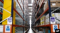 FILE - Inside view of the new Amazon warehouse located in Boves, northern France, Oct. 3, 2017.