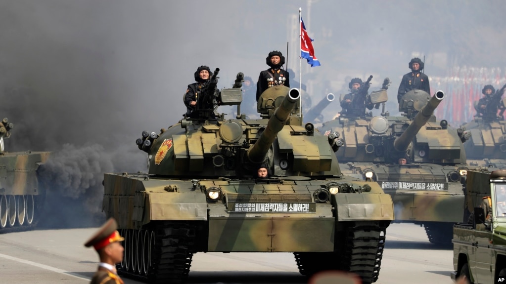 FILE - Soldiers in tanks are paraded across Kim Il Sung Square during a military parade, April 15, 2017, in Pyongyang, North Korea. The United Nations is investigating at least seven African countries accused of receiving military assistance from North Korea.