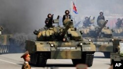 FILE - Soldiers in tanks are paraded across Kim Il Sung Square during a military parade, April 15, 2017, in Pyongyang, North Korea. 