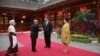 China's President Xi Jinping, center right, and his wife Peng Liyuan, right, welcome Cambodia's King Norodom Sihamoni, center left, and his mother former queen Monique, left, at Diaoyutai State Guesthouse Wednesday, Sept. 19, 2018, in Beijing, China. (Lintao Zhang/Pool Photo via AP)