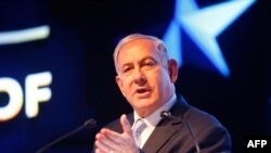 FILE - Israeli Prime Minister Benjamin Netanyahu speaks during an event marking one year since the US embassy moved to Jerusalem on May 14, 2019.