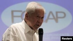 FILE - Albert del Rosario, at the time foreign secretary of the Philippines, is seen speaking to reporters in Manila, March 26, 2015.