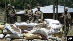 Soldiers stand near a checkpost which was attacked by militants in Upper Dir, along Pakistan's border with Afghanistan (File Photo - June 3, 2011).