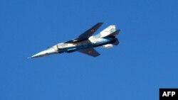 A handout picture released by the official Syrian Arab News Agency on December 20, 2011 shows aircraft take part in military maneuvers by the Syrian army in an undisclosed location in Syria.