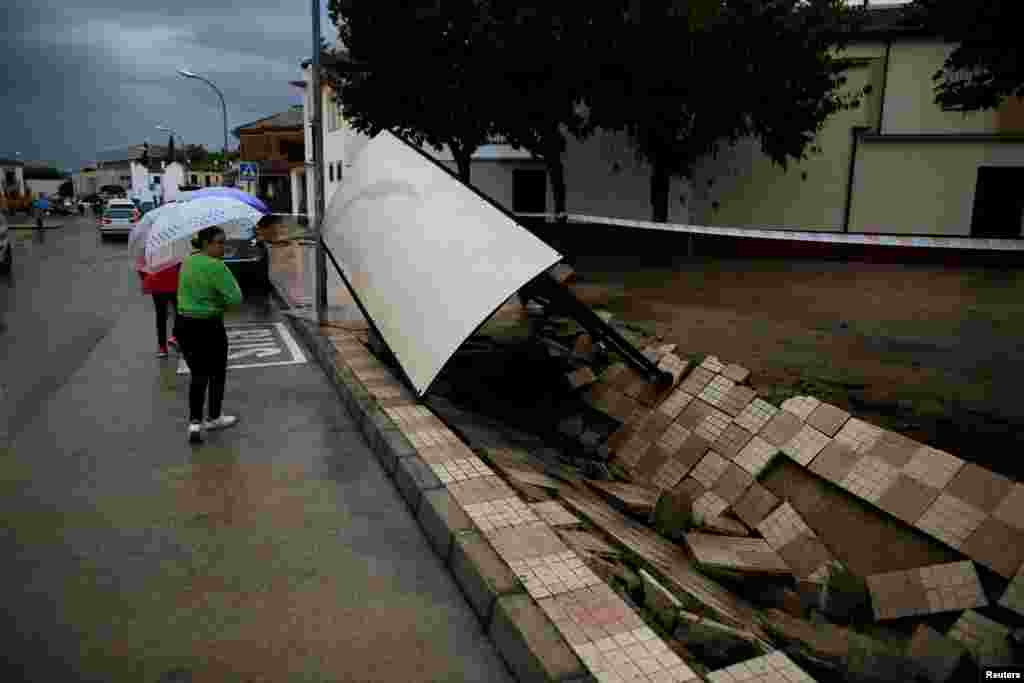 A destroyed bus stop is seen along a street after heavy rain and flash floods hit Campillos, southern Spain.