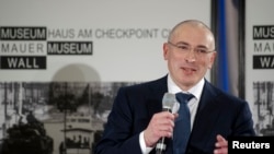 FILE – After Yukos shareholder Mikhail Khodorkovsky, shown in 2013, ran afoul of Russian President Vladimir Putin, the company was forced into bankruptcy. Losses blamed on Russia’s government have new sparked legal battles. 