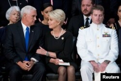 Cindy McCain, wife of late Sen. John McCain, center, talks with Vice President Mike Pence, left, after he spoke at a ceremony for John McCain in the Rotunda of the U.S. Capitol, Aug. 31, 2018, in Washington.