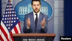 FILE- White House national economic director Brian Deese speaks during a press briefing at the White House in Washington.