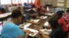 Teacher Gloria Pegram leads a summer school session at Bushman Elementary in Dallas, Texas. (VOA/B. Zeeble)