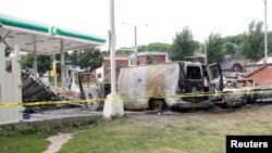 A burned down gas station is seen after disturbances following the police shooting of a man in Milwaukee, Wisconsin, U.S. Aug. 15, 2016. 