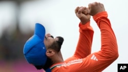 ویرات کوہلی، ورلڈ کپ میں اپنی ٹیم کی فتح کے بعد، فوٹو اے پی