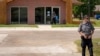 Security personnel stand outside a recently opened Planned Parenthood clinic, Sept. 10, 2024, in Pittsburg, Kan.