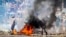 A barricade burns in Mozambique's capital, Maputo, Nov. 5, 2024, in protests that have engulfed the country after the opposition rejected the results of the country's polls which saw the Frelimo party extend its 58-year rule. 