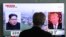 A man watches a TV screen showing file footage of U.S. President Donald Trump, right, and North Korean leader Kim Jong Un during a news program at the Seoul Railway Station in Seoul, South Korea, May 16, 2018. 