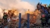 In this photo provided by the Ukrainian Emergency Service, rescuers work at a damaged building after a Russian missile attack in Kyiv region, Ukraine, May 8, 2024. 