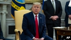 President Donald Trump speaks during a meeting in the Oval Office of the White House, in Washington, Dec. 17, 2019.