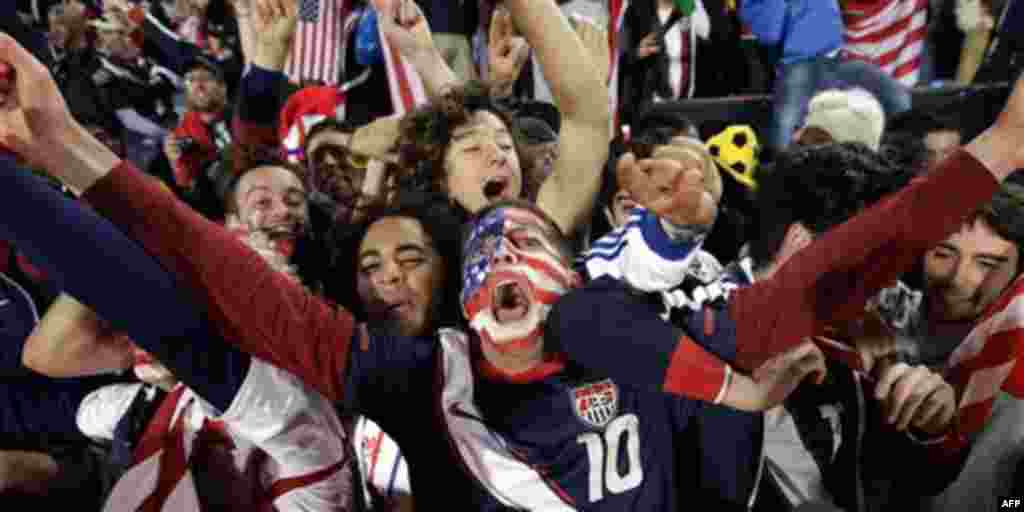 United States fans celebrate at the end of the World Cup group C soccer match between the United States and Algeria at the Loftus Versfeld Stadium in Pretoria, South Africa, Wednesday, June 23, 2010. United States won 1-0. (AP Photo/Yves Logghe)