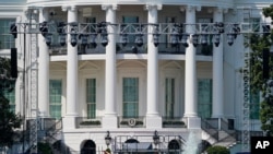 Workers construct staging on the South Lawn of the White House in Washington, Aug. 25, 2020. President Donald Trump is expected to speak to from the South Lawn of the White House Thursday night. 