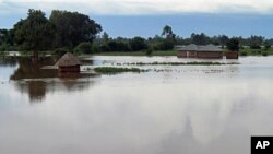 Homes flooded by water after the river Sondu Miriu burst it's banks in southern Nyanza , Kenya, April 29, 2012.