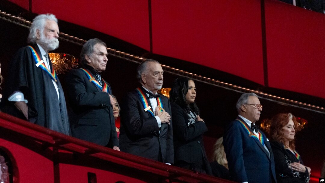 From left, 2024 Kennedy Center honorees the Grateful Dead band members Bobby Weir and Mickey Hart; filmmaker Francis Ford Coppola and Michelle Ebanks; Arturo Sandoval and Bonnie Raitt during the 47th Kennedy Center Honors at the John F. Kennedy Center in Washington, Dec. 8, 2024.