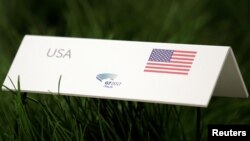 A US placard is seen on the table during a summit of Environment ministers from the G7 group of industrialized nations in Bologna, Italy, June 11, 2017. 