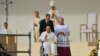 Pope Francis exits the stage on a wheelchair after a holy mass at King Baudouin stadium, in Brussels on Sept. 29, 2024. 