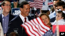 Former U.S. Sen. Rick Santorum, center, stands with his family as he announces his candidacy for the Republican nomination for president, May 27, 2015 in Cabot, Pennsylvania.