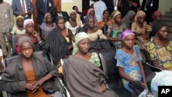FILE - Chibok school girls, recently freed from Boko Haram captivity, are seen during a meeting with a government official in Abuja, Nigeria on Oct. 13, 2016.